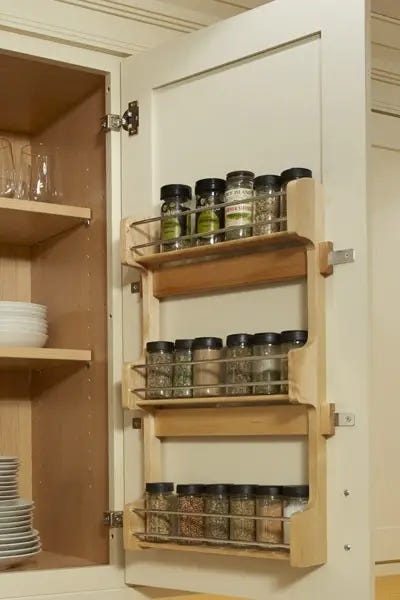 Cabinet door-mounted spice rack on cream shaker cabinets Cabinet door-mounted spice rack on cream shaker cabinets