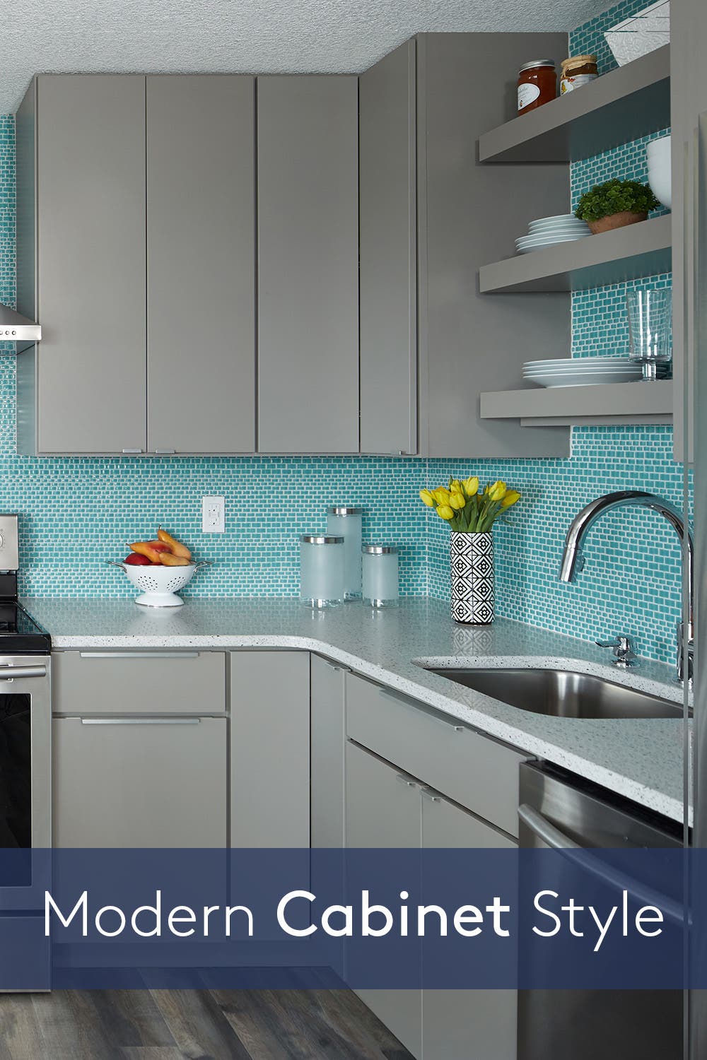 Modern kitchen design with gray slab cabinets and bright blue accent tile