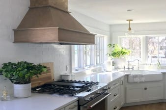 Blogger Design Sixty Five completed extensive renovations to transform her 1920s beach house kitchen into a modern space with coastal elegance.