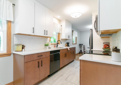 Galley style two-tone kitchen in white and wood slab door kitchen cabinets