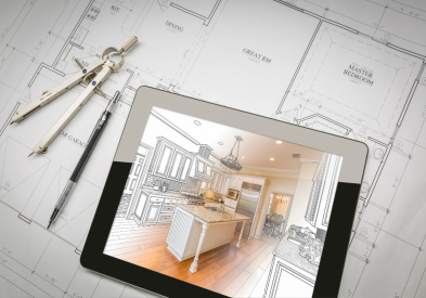 iPad kitchen rendering laying on top of paper floor plans and a protractor