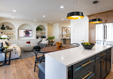 Decorative shaker kitchen with light wood perimeter and indigo island cabinets with white stone waterfall countertop 