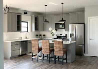 For this project, CliqStudios Pro Partner Sarah chose Medium Gray cabinets because they spoke casual and modern for this open kitchen design