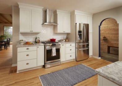 Timeless White Shaker Kitchen Accented with Rich Blue Cabinets