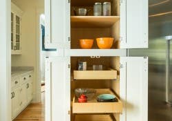 Kitchen remodeling project features CliqStudios.com inset cabinets in the Shaker Inset cabinet style in a painted White finish. Features include this built-in tall pantry cabinet with slide-out shelves for easy-reach storage and organization. Kitchen remodeling project features CliqStudios.com inset cabinets in the Shaker Inset cabinet style in a painted White finish. Features include this built-in tall pantry cabinet with slide-out shelves for easy-reach storage and organization.