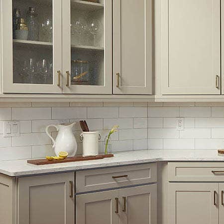 Kitchen with gray CliqStudios cabinets and white subway tile backsplash