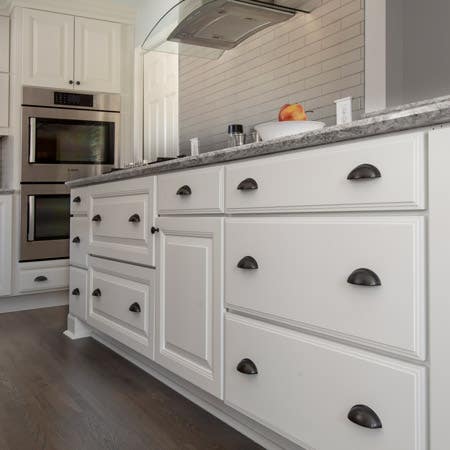 white base cabinet drawers with cup pulls
