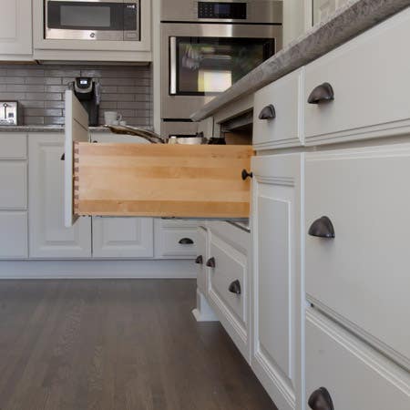 Open pot and pan drawer with hardwood sides and dovetail joints