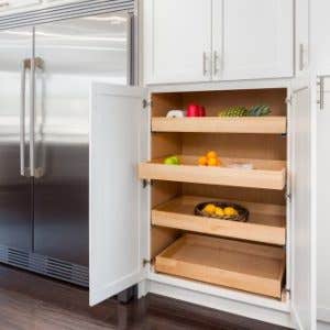 Tall pantry cabinet in shaker door style with four roll-out trays