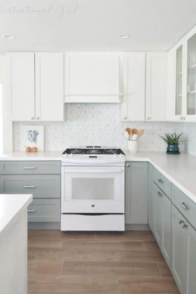 CliqStudios cabinets in Shaker Painted White and Painted Blue gray are the perfect timeless choice in a kitchen makeover by blogger Kate Riley of CentsationalGirl.com