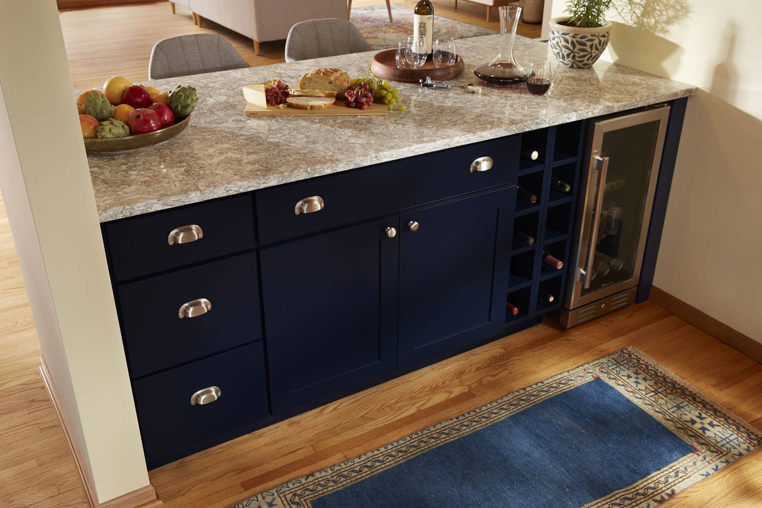 Matching cup pulls and knobs on blue cabinet.