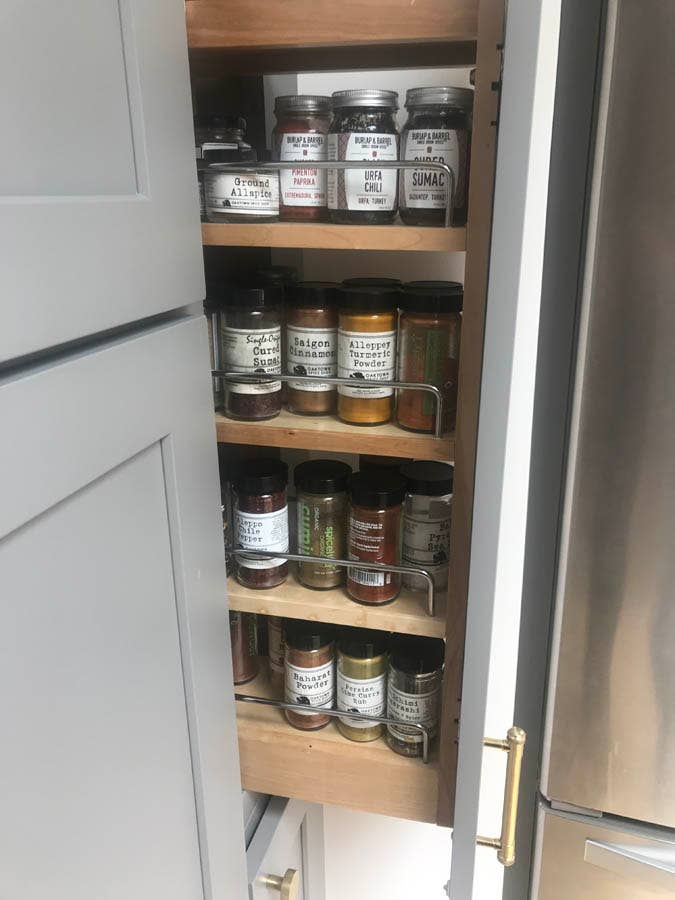 pull-out spice rack with adjustable shelves. pull-out spice rack with adjustable shelves.