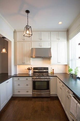 wall of white shaker cabinets in historic home remodel