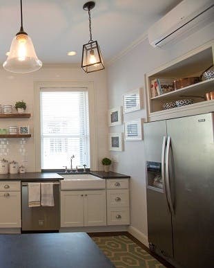 stainless refrigerator with open shelves above