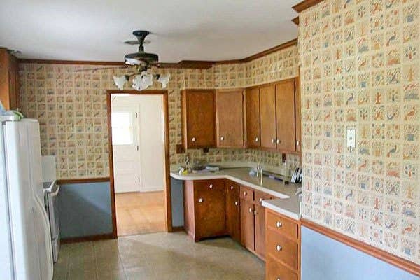 kitchen with blue wallpaper, golden oak cabinets and linoleum flooring kitchen with blue wallpaper, golden oak cabinets and linoleum flooring