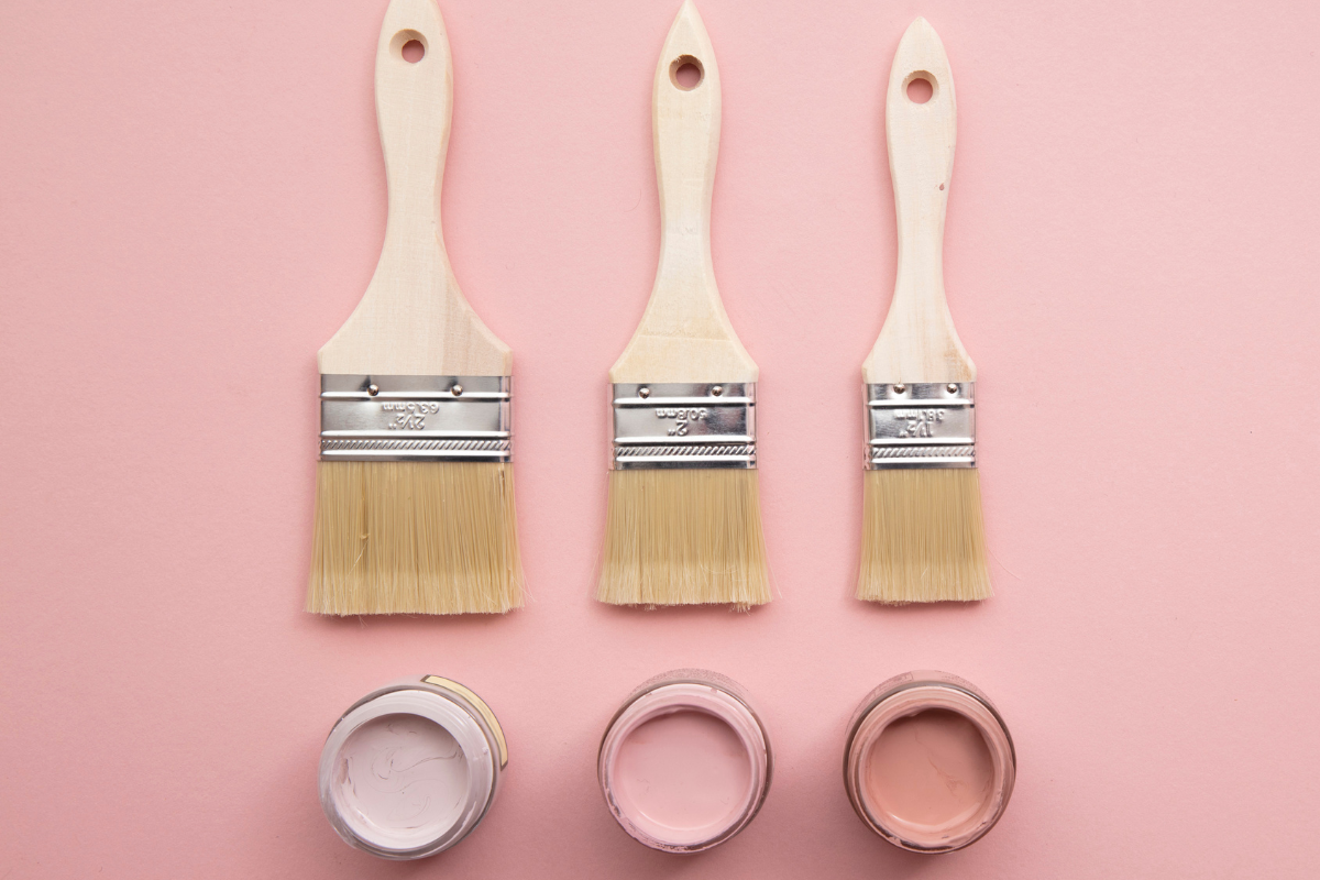 Pastel pink paint samples and brushes