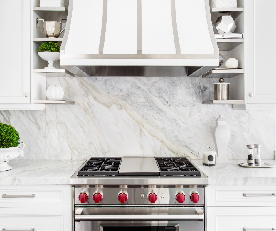 Decorative white shaker kitchen cabinets with large stainless steel range 