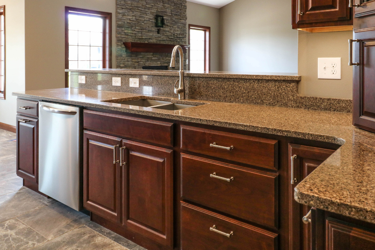 Raised panel wood kitchen cabinets with radius countertop corners Raised panel wood kitchen cabinets with radius countertop corners