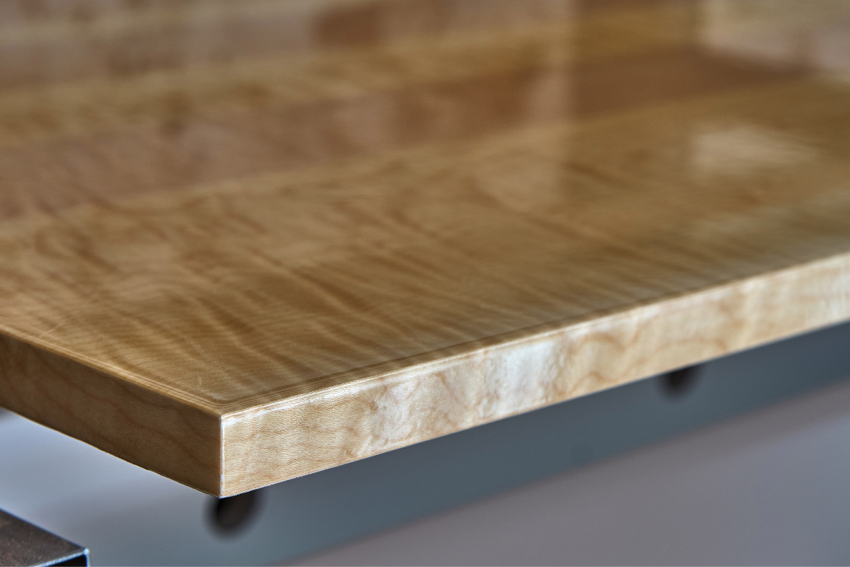High-gloss wood finish on a large wood panel High-gloss wood finish on a large wood panel