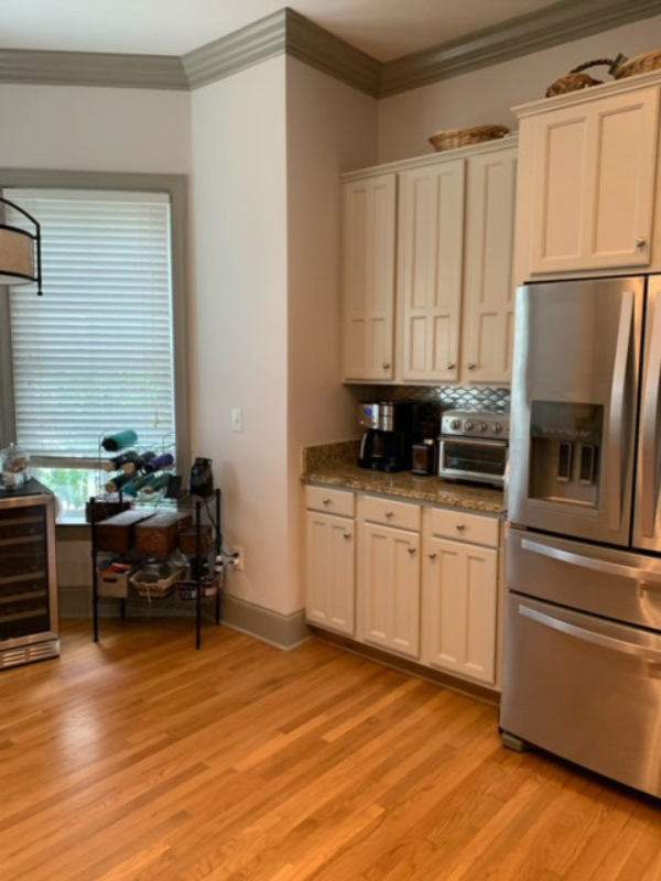 Before photo with older cabinets and an outdated peninsula design Before photo with older cabinets and an outdated peninsula design