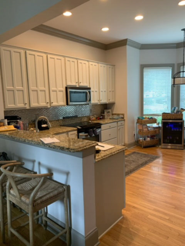 Before photo with older cabinets and an outdated peninsula design Before photo with older cabinets and an outdated peninsula design