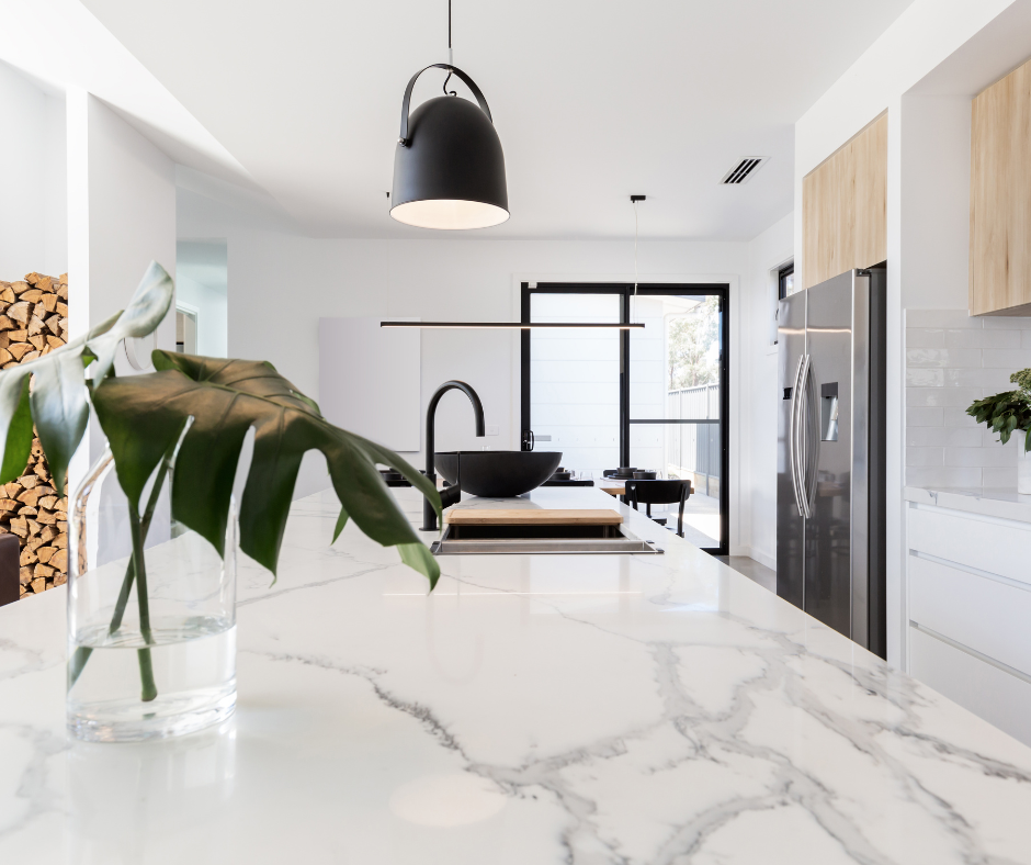 White and wood slab door kitchen cabinets with large marble island White and wood slab door kitchen cabinets with large marble island