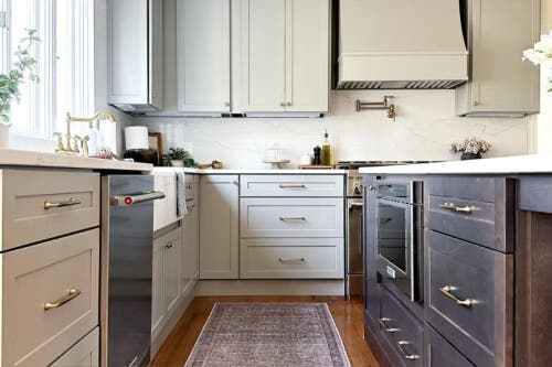 Duluth Pebble kitchen cabinets Transitional two-tone shaker kitchen design with beige cabinets and a dark brown stained island
