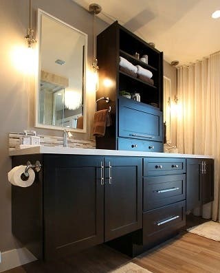 bathroom cabinets in dark wood stain with floating vanities and center hutch