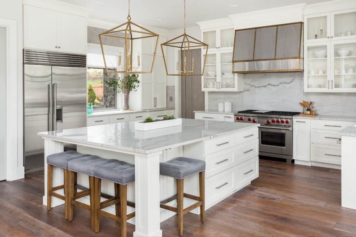Large white shaker kitchen with decorative island Large white shaker kitchen with decorative island and white stone countertops