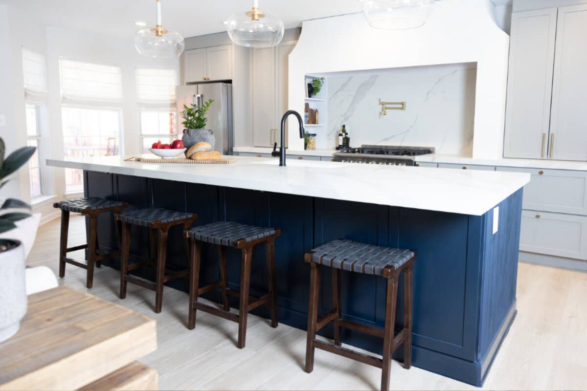 Light gray shaker kitchen design with large navy blue island Light gray shaker kitchen design with large navy blue island and white countertops