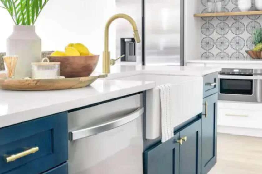 Northfield White and Ocean Blue kitchen cabinets White beachy shaker kitchen design with wood floating shelves and navy blue island cabinets