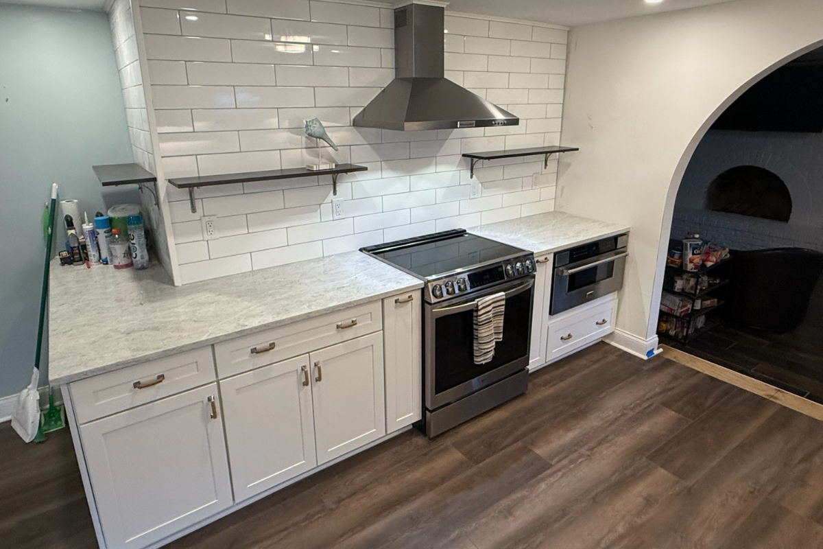 White shaker kitchen remodel with a range