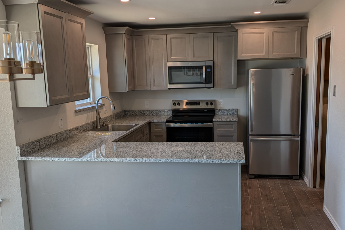 decorative U-shaped shaker kitchen design with gray and beige paint color