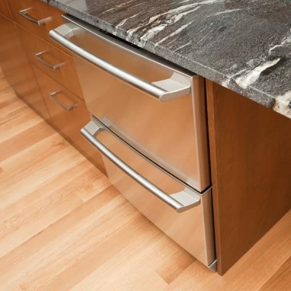 Two stacked refrigerator drawers in a kitchen island Two refrigerator drawers in a kitchen island with dark gray granite countertops