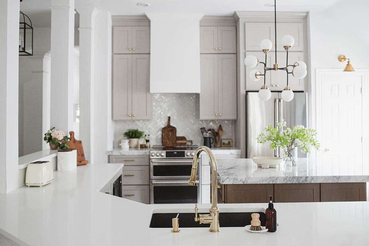 Shaker kitchen cabinets in light gray and medium-brown stained island Shaker kitchen cabinets in light gray and medium-brown stained island