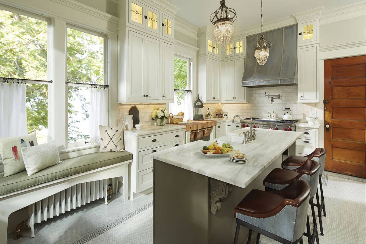 Shaker Inset cabinets in White and Green, over-island pendant lights, glass-front cabinet accent lights and under-cabinet task lights.