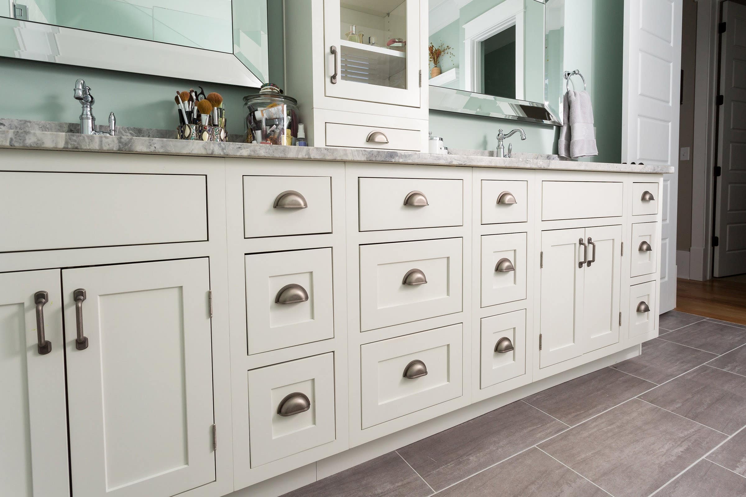 CliqStudios bath cabinets shown in Shaker White door style and finish.