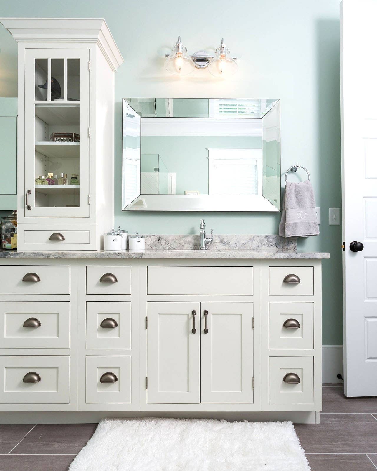 CliqStudios bath cabinets shown in Shaker Inset White door style and finish