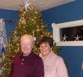 photo of CliqStudios customers Bob and RuthAnn Roth in front of a Christmas tree in their Cape Cod home photo of CliqStudios customers Bob and RuthAnn Roth in front of a Christmas tree in their Cape Cod home