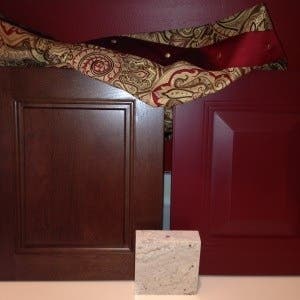 samples of cherry beaded cabinet door, red raised panel cabinet door, granite and fabric samples of cherry beaded cabinet door, red raised panel cabinet door, granite and fabric