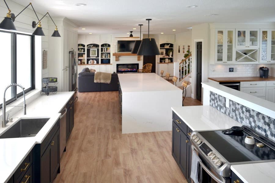 Full view of a two-toned kitchen using CliqStudios Shaker cabinets in Black and White. The countertops are white and butcherblock. Full view of a two-toned kitchen using CliqStudios Shaker cabinets in Black and White. The countertops are white and butcherblock.
