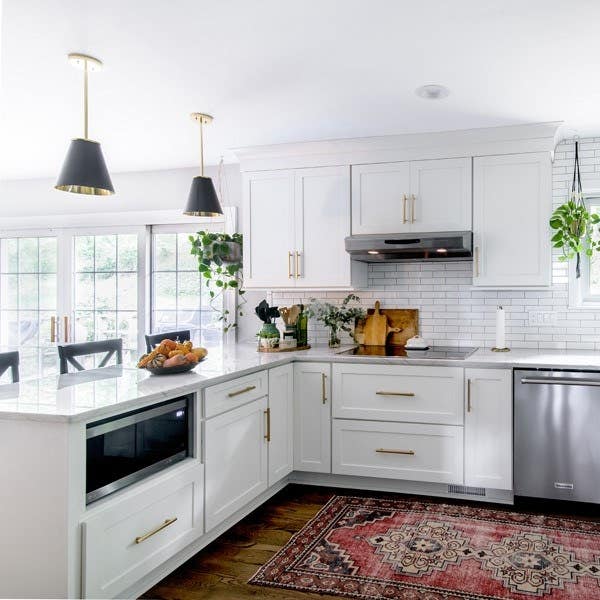 White shaker kitchen cabinets with microwave base cabinet