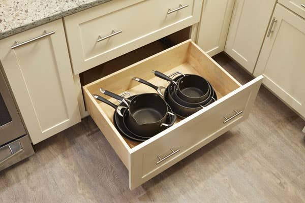 CliqStudios Shaker style pots and pans deep drawer Painted cream cabinet with stacked cookware