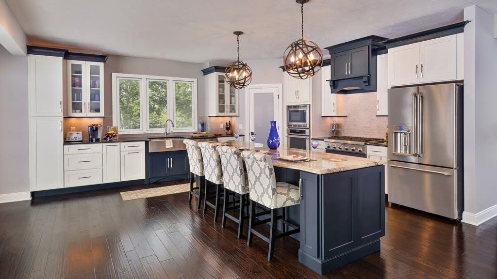 black and white two tone kitchen with center island and wood range hood black and white two tone kitchen with center island and wood range hood