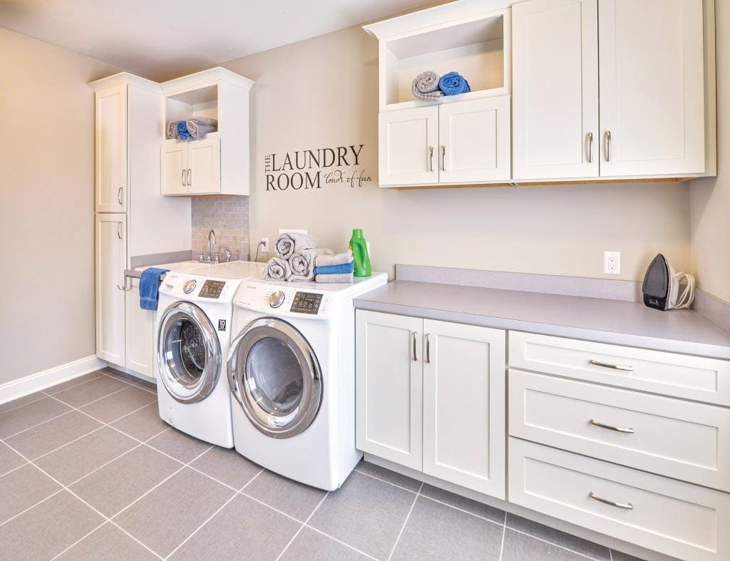 Spacious and bright laundry room custom built with CliqStudios.com shaker style cabinets. Shown Shaker cabinet style in painted White finish. Spacious and bright laundry room custom built with CliqStudios.com shaker style cabinets. Shown Shaker cabinet style in painted White finish.