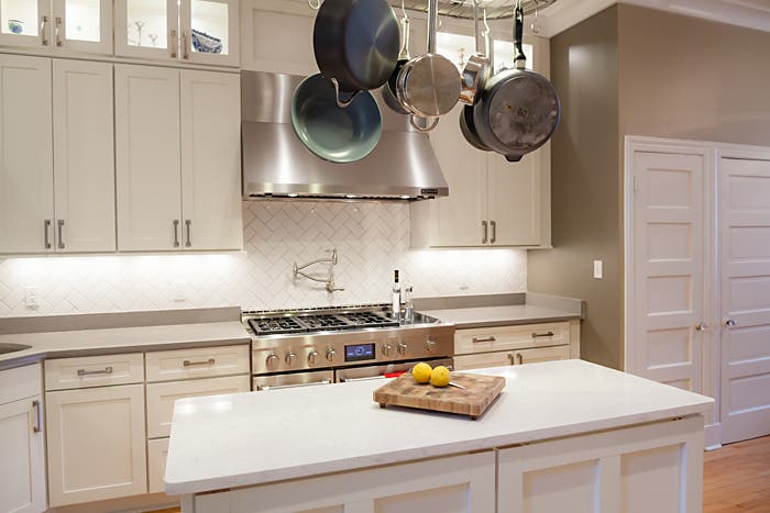 white shaker cabinets in remodeled dc home complement the home's original painted white wooden doors, with five recessed flat panels each white shaker cabinets in remodeled dc home complement the home's original painted white wooden doors, with five recessed flat panels each