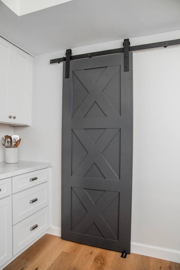 Farmhouse Barn Door Hides Pantry