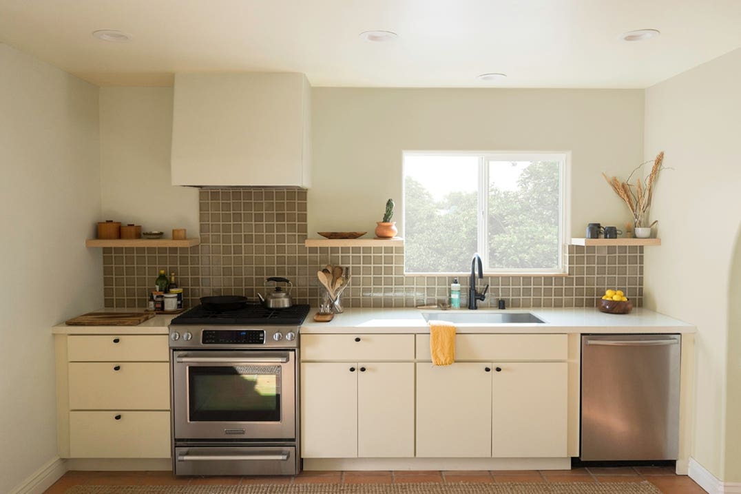 black cabinet knobs on contemporary slab door cabinets