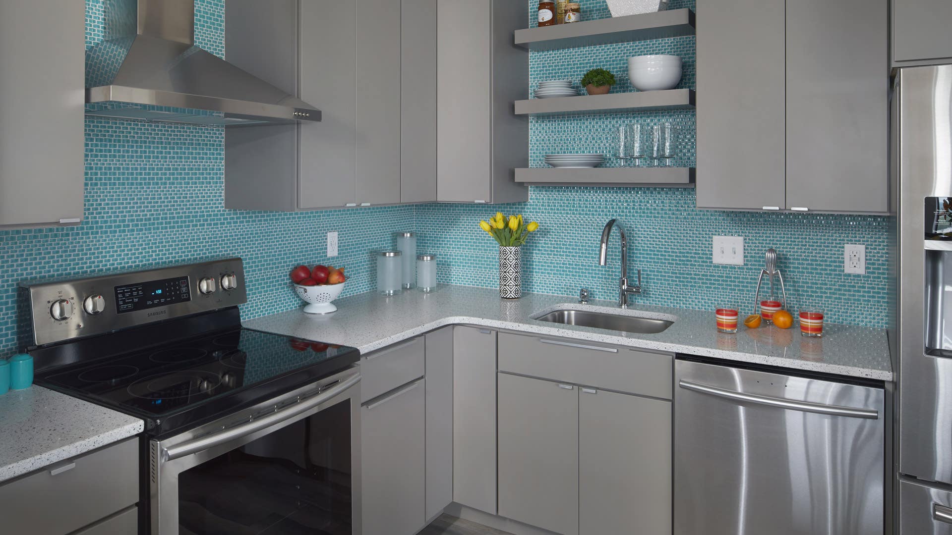 Slab Cabinet Aesthetics. Gray slab door style kitchen cabinets.