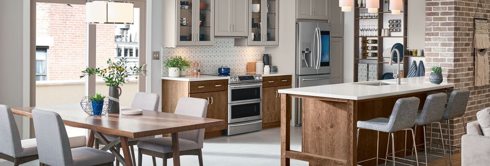 Adrian Maple Macchiato and Wynn Cherry Eagle Rock kitchen cabinets One-wall kitchen design with white shaker wall cabinets and medium wood base cabinets and a kitchen island.